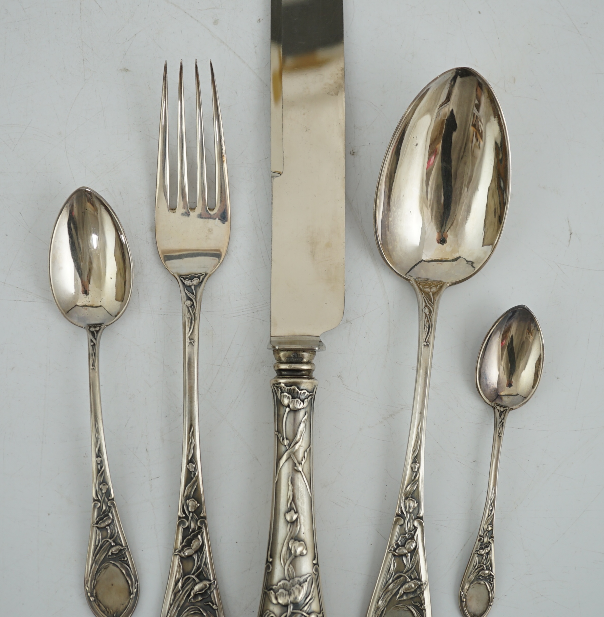 An early 20th century Russian 84 zolotnik silver five piece personal cutlery set by Ivan Khlebnikov